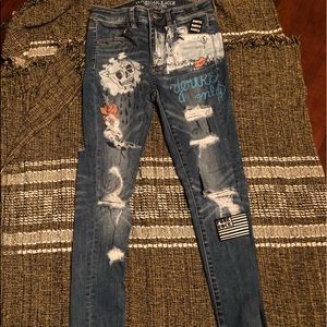 AE distressed/badged jeans
